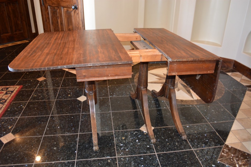 Our “unfinished” kitchen table (as the house which we were remodeling) was used symbolically for our “unfinished” family in the book. Amy found the antique Duncan Phyfe mahogany drop leaf claw foot table at a garage sale. 