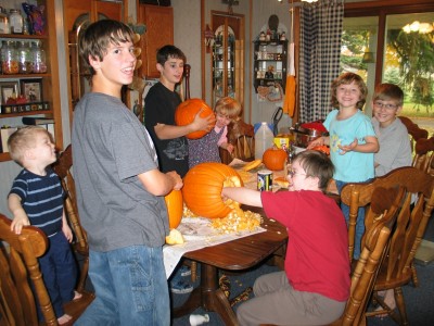 Simmons kids carving pumpkins