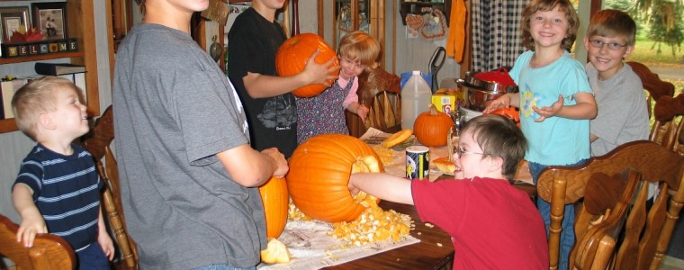 Simmons kids carving pumpkins