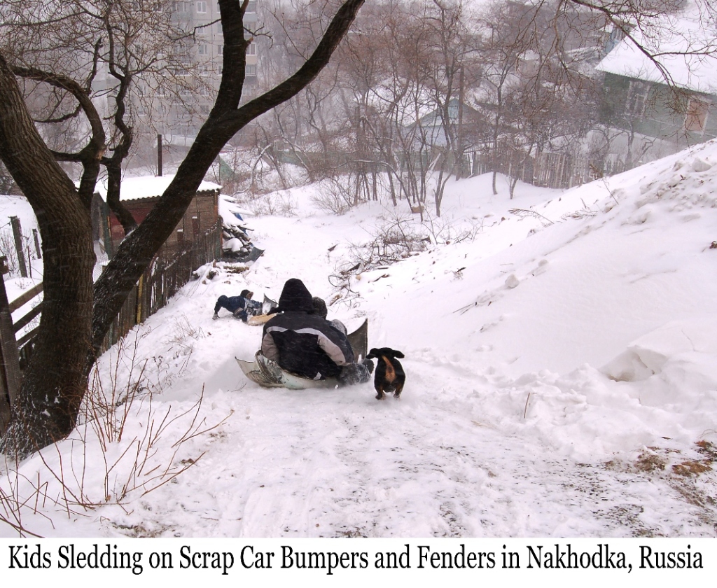 Kids Sledding on car Bumper in Nakhodka, Russia