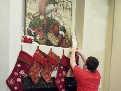 Jack Simmons hanging Christmas Stockings